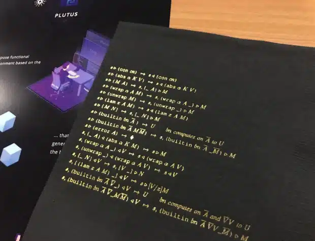 Foto comprovando que a especificação da linguagem Plutus cabe em um pequeno guardanapo