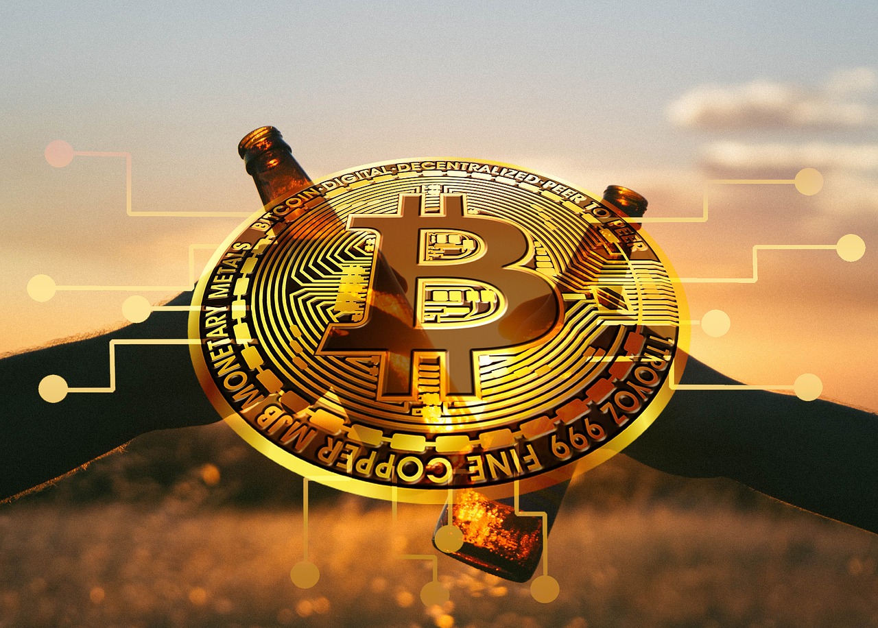 Bitcoin em meio ao pôr do sol e brinde de cerveja