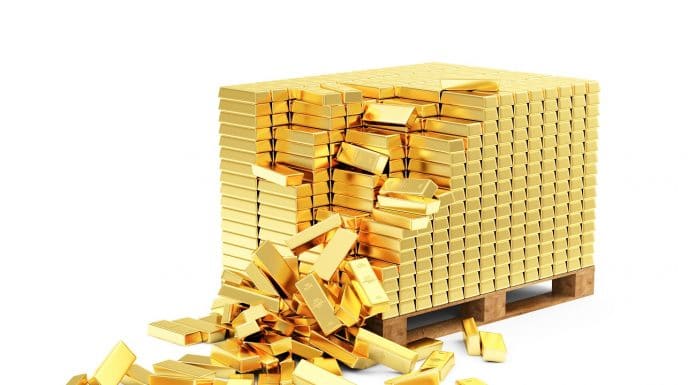 Monte de ouro empilhado e caindo comprar