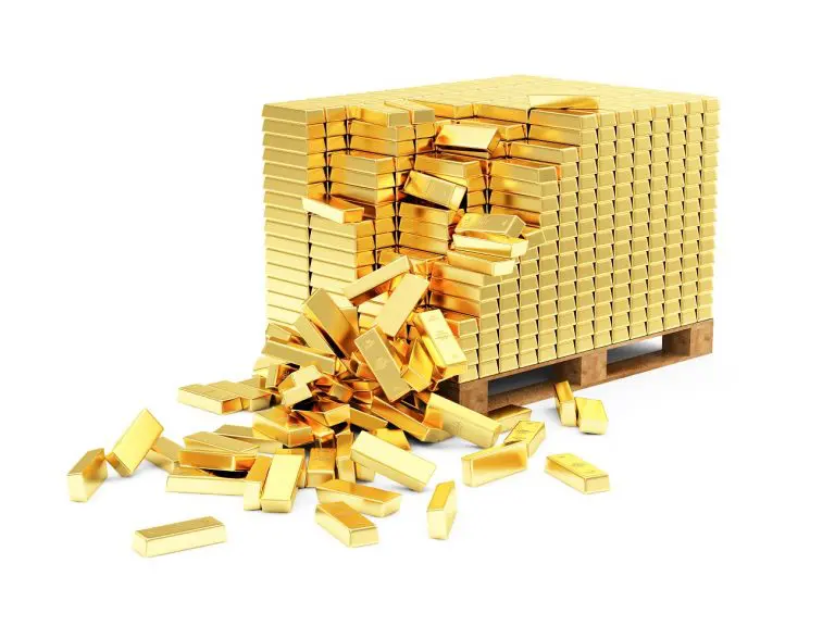 Monte de ouro empilhado e caindo comprar
