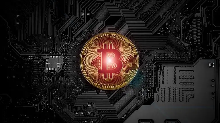 Moeda digital Bitcoin com luz vermelha