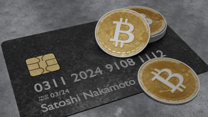 Cartão com nome de Satoshi Nakamoto e Bitcoin