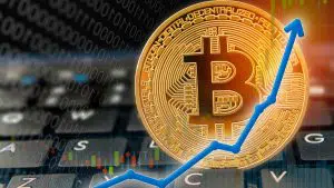 Gráfico de preço do Bitcoin para alta em cima de teclado