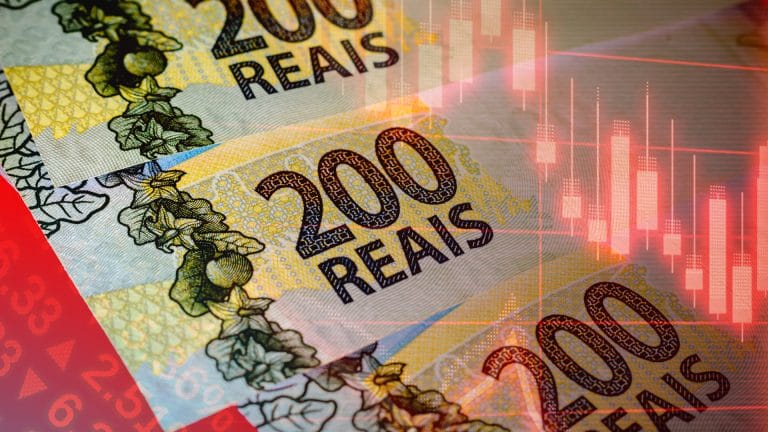 Notas de R$ 200,00 e gráficos de negociações Real digital