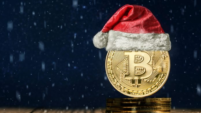 Bitcoin com chapéu de Papai Noel, símbolo do Natal