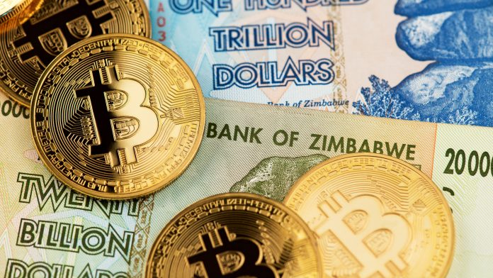 Bitcoin e notas de cédulas do Zimbabwe de 20 bilhões e 100 trilhões de dólares