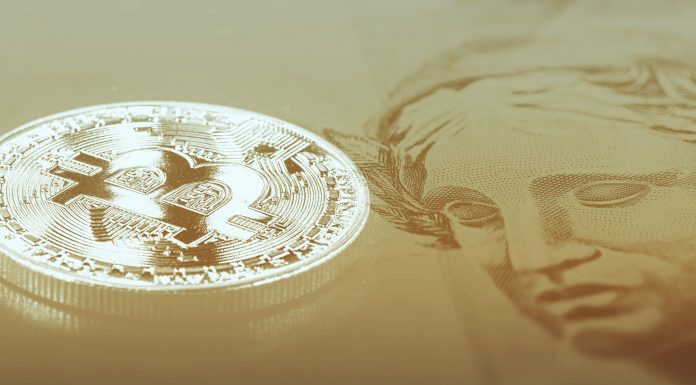 Moeda Bitcoin e Cédula de Real