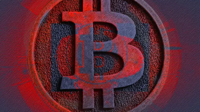 Emblema do Bitcoin de vermelho, sinal de queda no mercado