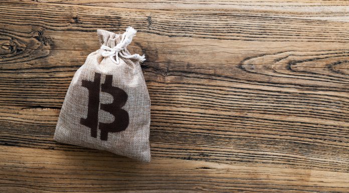 Saco de dinheiro com símbolo do Bitcoin