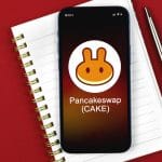 PancakeSwap com caderno de lista com fundo vermelho