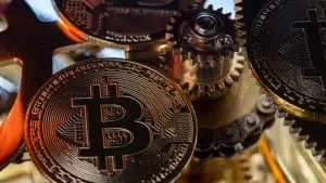 Moeda de bitcoin e engrenagens