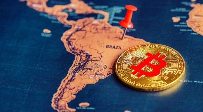 Alfinete vermelho e bitcoin no mapa do Brasil