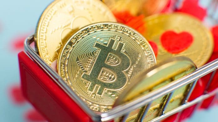 Bitcoin em carrinho de compra com imagem de coração, romance