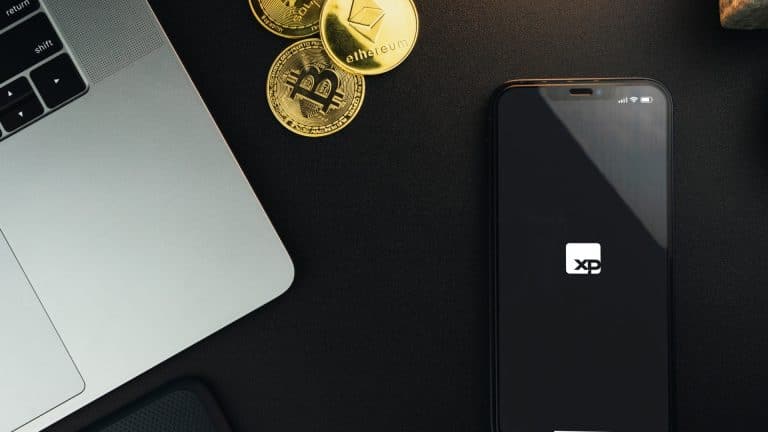 Aplicativo da XP Investimentos próximo do Bitcoin e Ethereum, criptomoedas