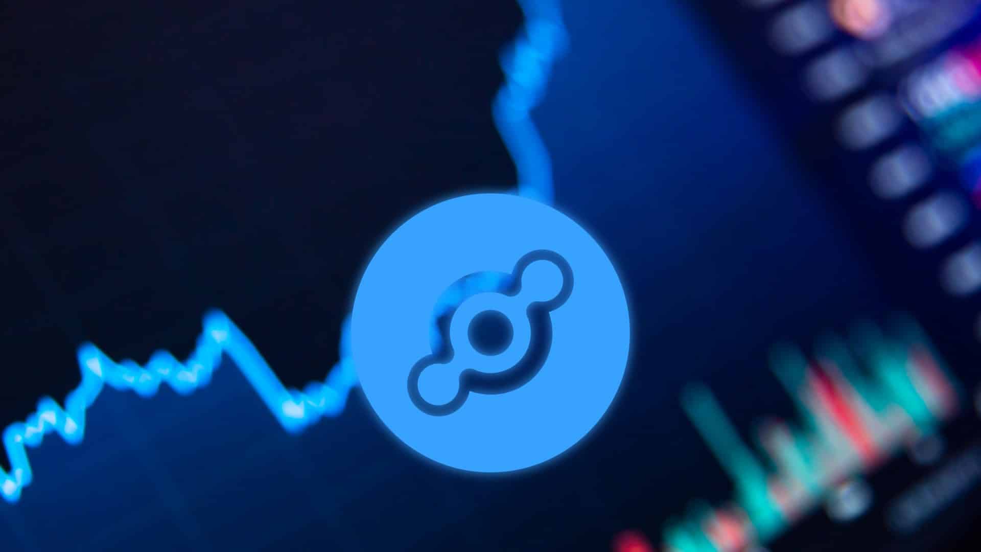 Símbolo da criptomoeda Helium próximo de gráficos