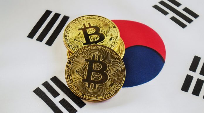 Moedas de Bitcoin sobre bandeira da Coréia do Sul.