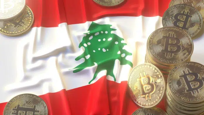 Moedas de Bitcoin sobre bandeira do Líbano.