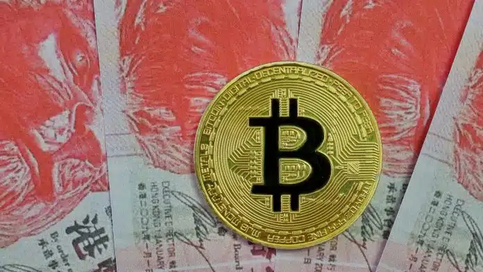 Bitcoin sobre notas de Dólar de Hong Kong.