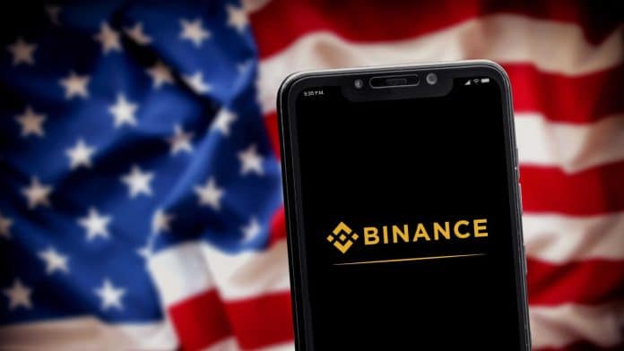 Binance e bandeira dos EUA.
