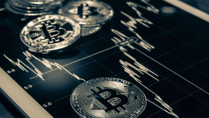 Bitcoin sobre gráfico de preços.