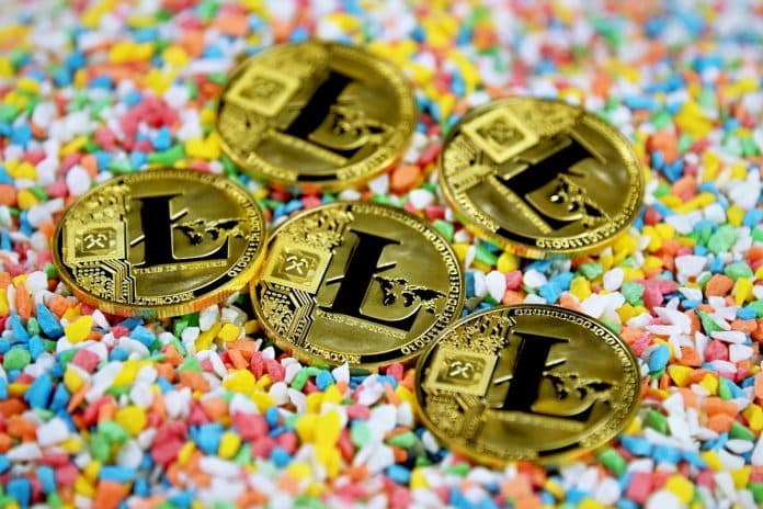 Moedas simbólicas de Litecoin com fundo colorido