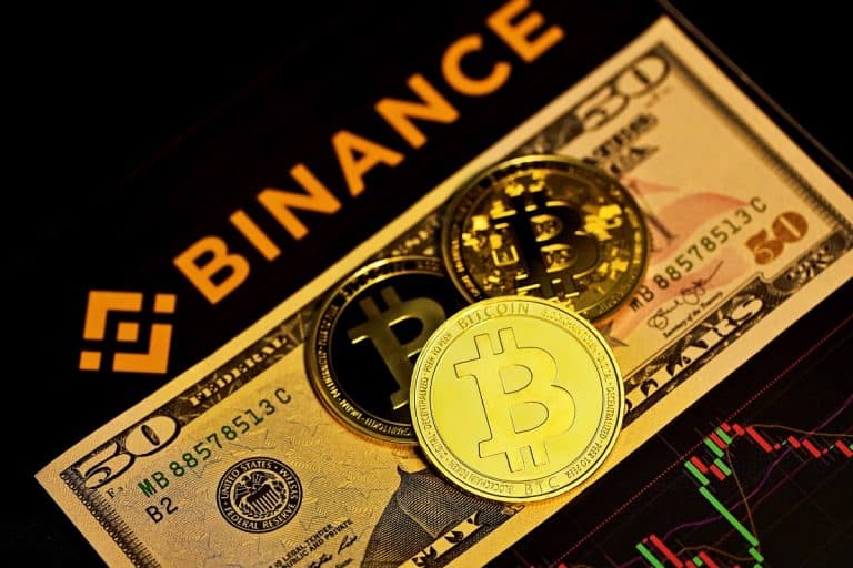 Gráficos da Binance, do Dólar e moedas simbólicas de bitcoin