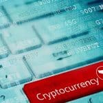 Foto de botão em teclado com texto de Criptomoedas