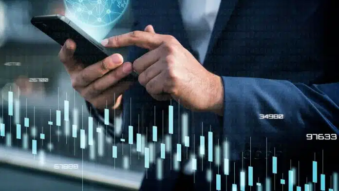 Investidor com gráficos de alta nos preços próximo